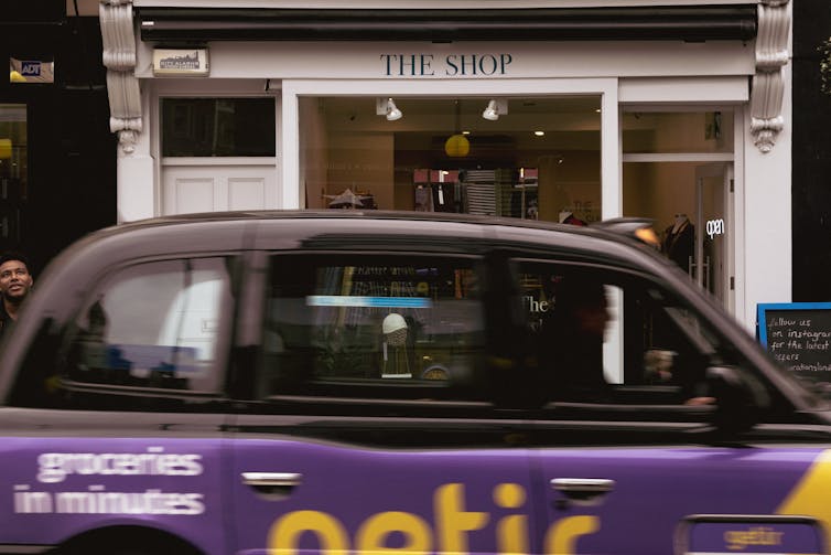 A cab with an ad for an online grocery company.