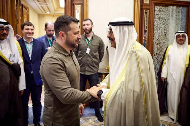 Ukrainian president, Volodymyr Zelensky, shakes hands with Saudi Crown Prince Mohammed bin Salman Al Saud