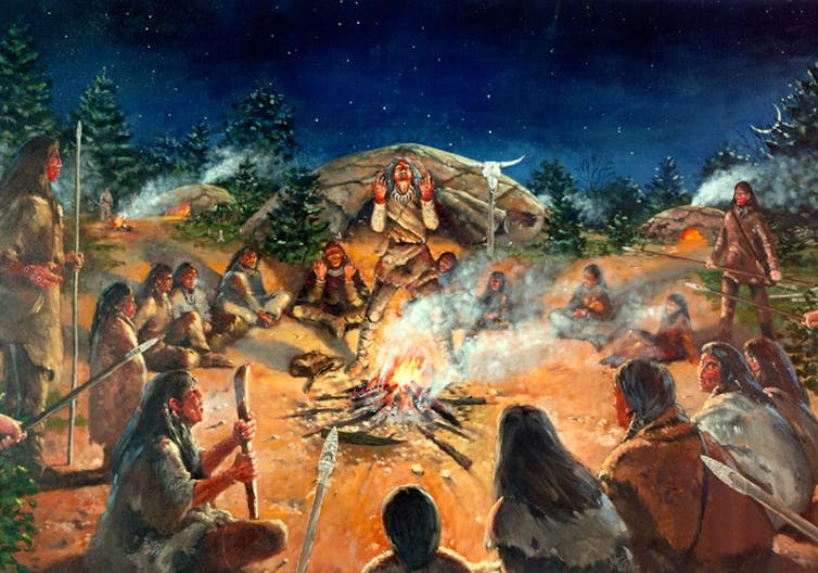 Artist's rendition of Paleoamerican Clovis encampment with people sitting around campfire under night sky
