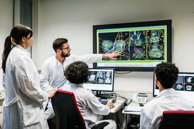 Doctors in computer lab looking at imaging results