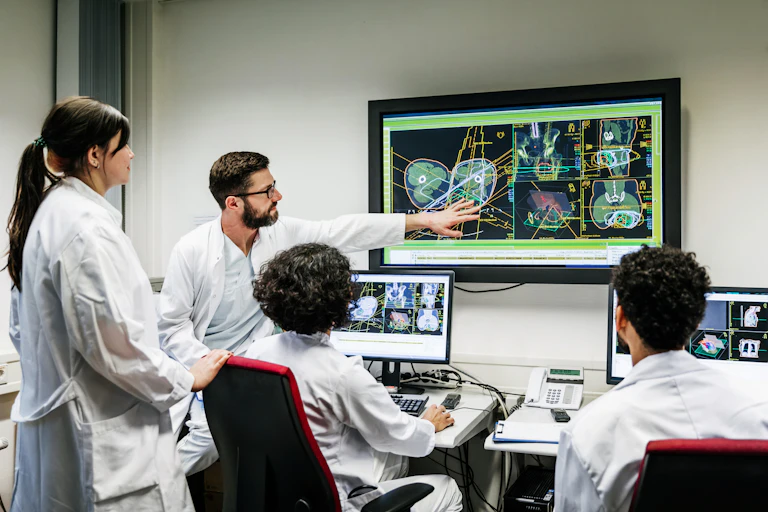 Doctors in computer lab looking at imaging results