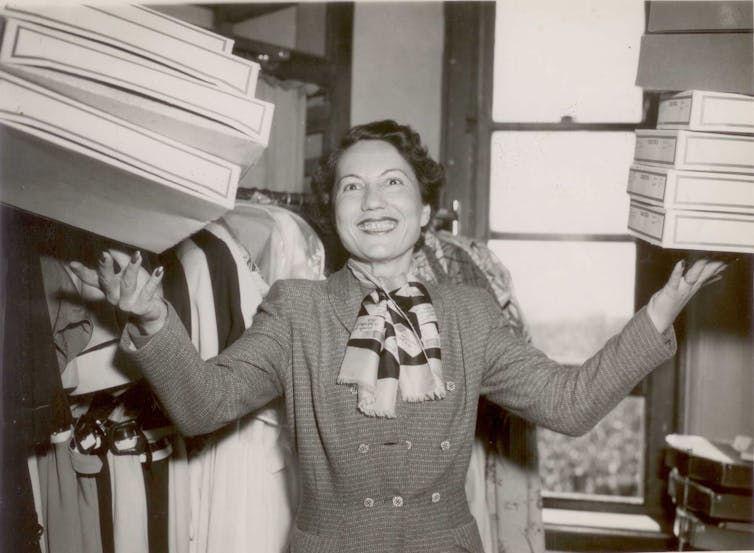 A woman holding up boxes