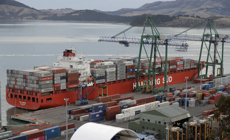 containers being loaded onto ship
