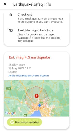 A screencap of a phone message stating an earthquake was reported with safety info and a link to updates