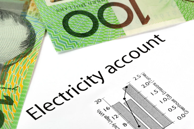 $100 bills on top of an electricity account