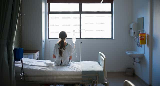 Patient waiting on a hospital bed