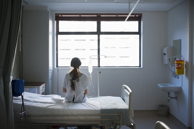 Patient waiting on a hospital bed