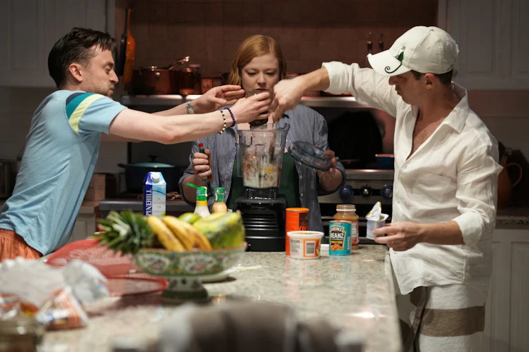 The Roy Siblings playfully fighting over a blender.