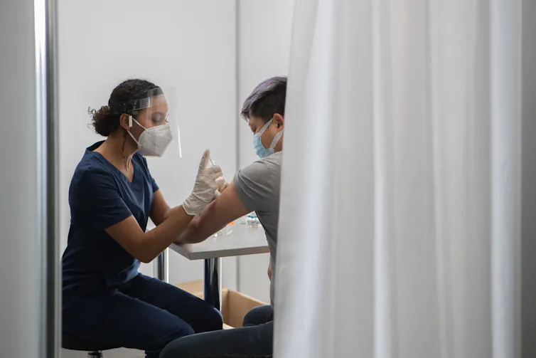 Clinician vaccinates man