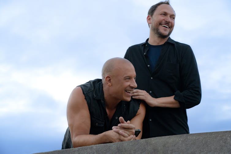 Star and co-producer Vin Diesel and director Louis Leterrier laughing together.