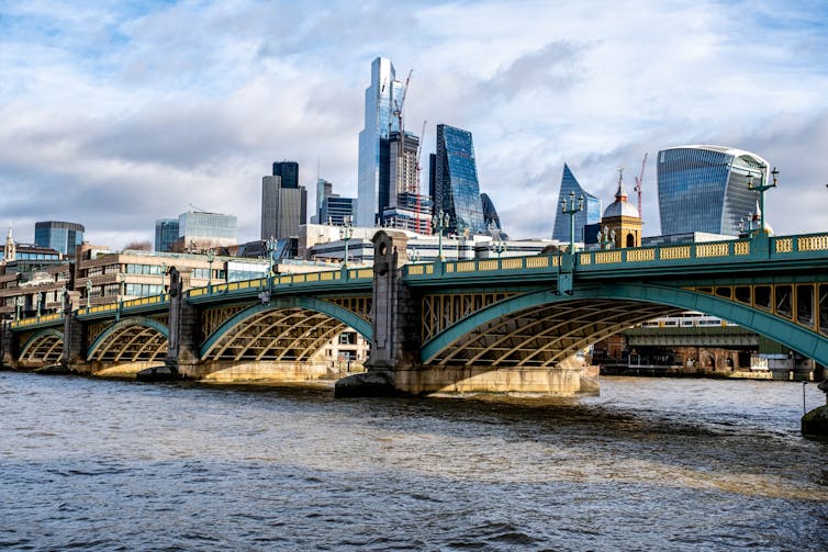 London's financial district skyline behind Southwark Bridge over the River Thames