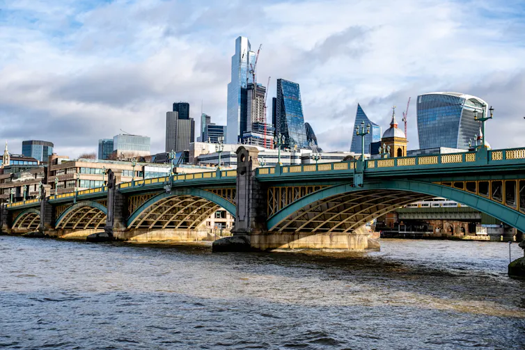 London's financial district skyline behind Southwark Bridge over the River Thames