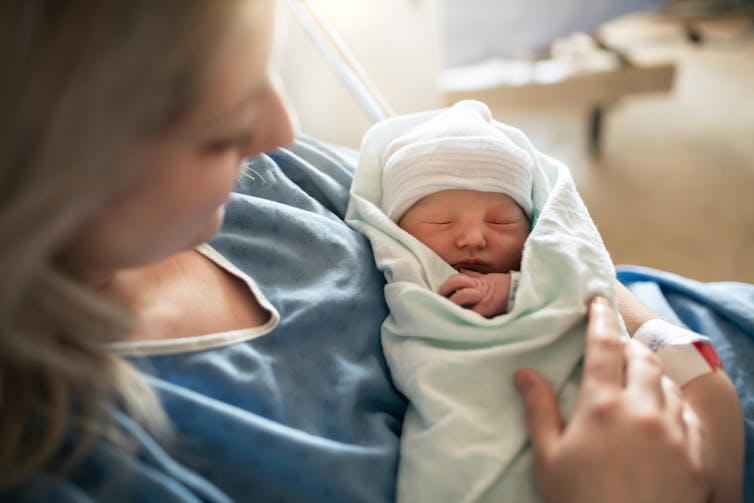 Mother with her newborn baby at the hospital