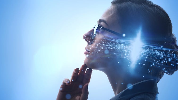 Photo illustration of a woman wearing glasses, with stars and galaxies in her head to represent thinking