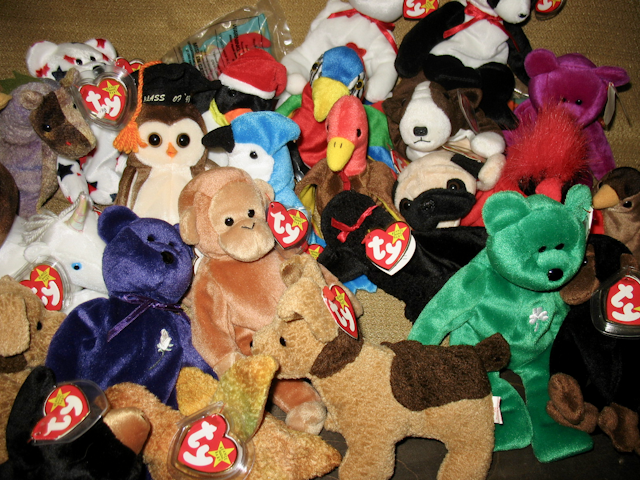 A pile of different plush toys all with heart shaped ear tags saying "ty."