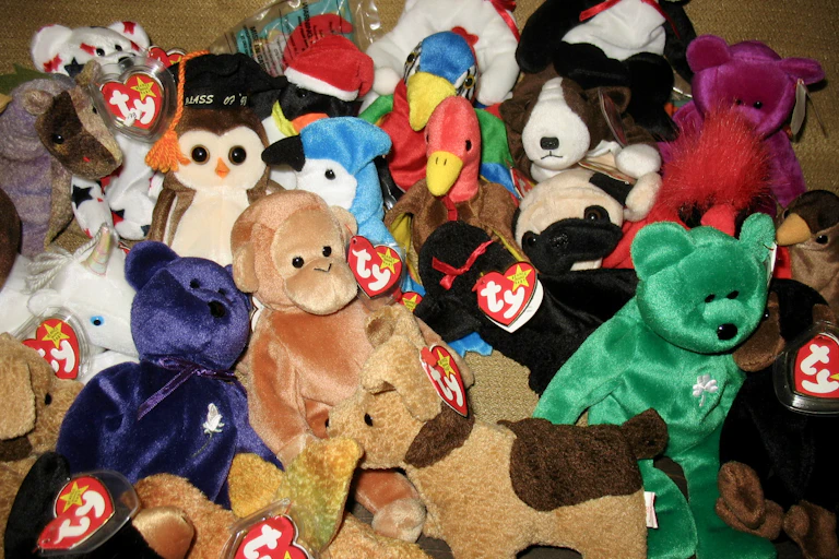A pile of different plush toys all with heart shaped ear tags saying "ty."