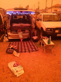 Van at evacuation centre with toddler