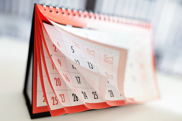 The pages of a calendar in motion.