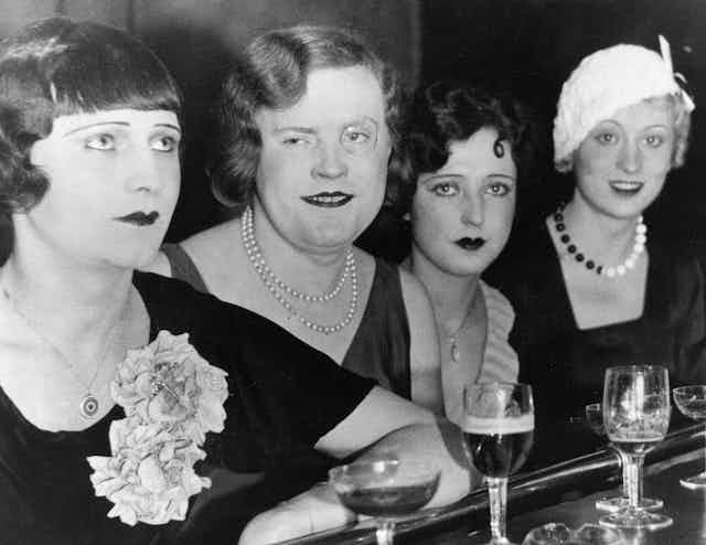 Black and white photo of four trans women.