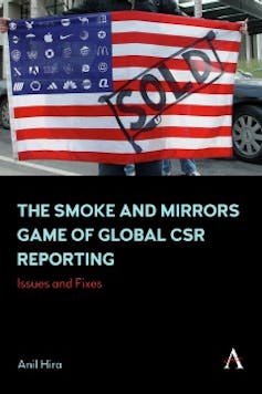 A black book cover with a graphic similar to an American flag except the white stars have been replaced with corporate logos. The word 'SOLD' is stamped across the flag. Beneath this graphic is the title of the book.
