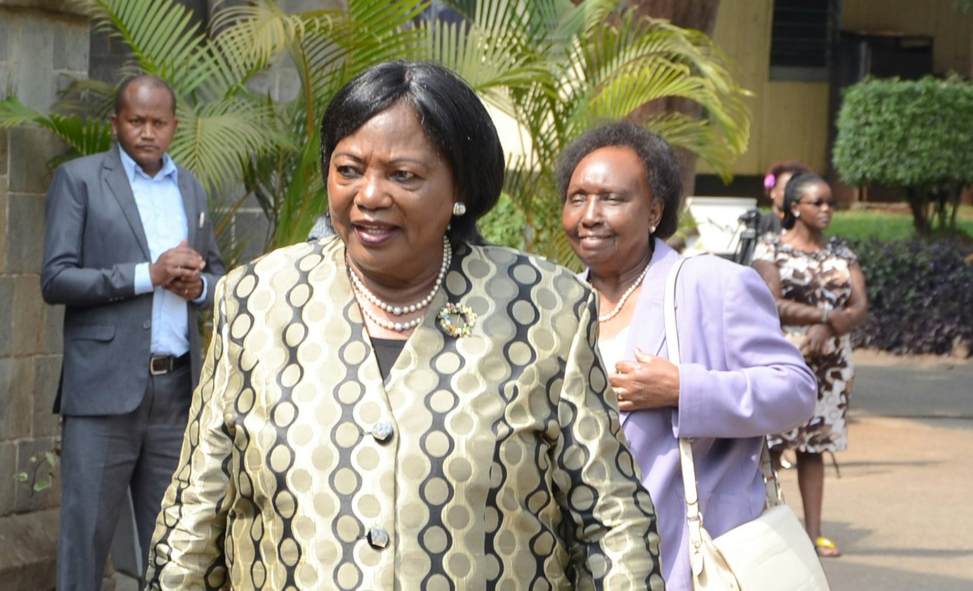 An image of Mama Ngina Kenyatta, with some people in the background