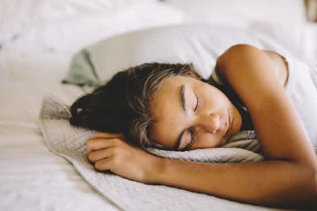 teen girl sleeps on side