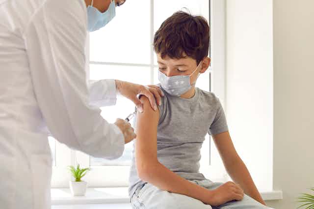 A boy receives a vaccine.