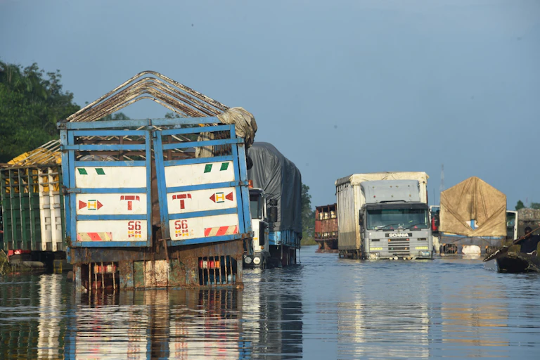 Trucks on a flooded road