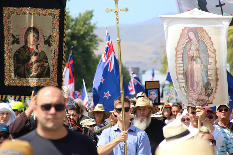 Protestors with banners and flags.