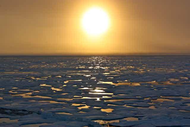 Sun sets over sea ice