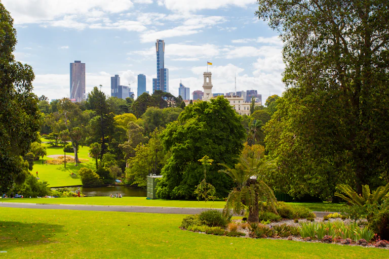 View across botanical gardens towards CBD high-rise buildings