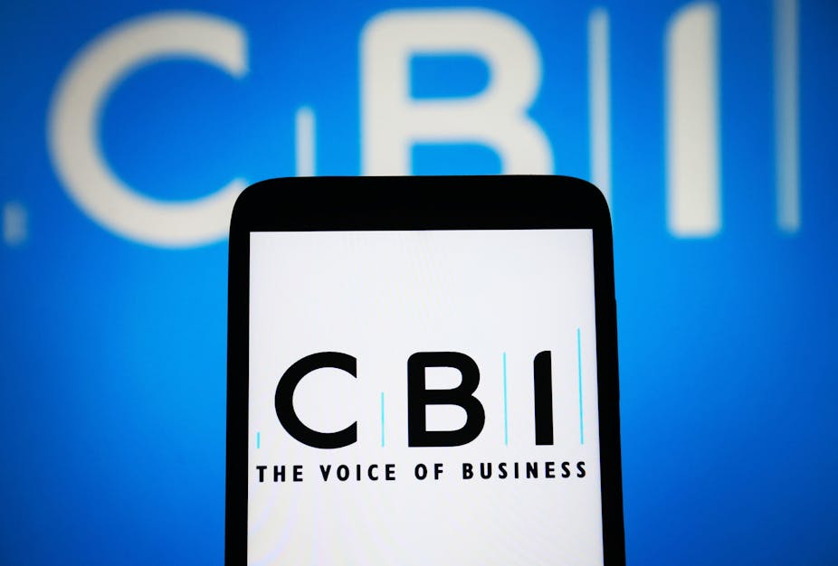 An iphone screen with the CBI logo and tagline "The voice of business" in front of a blue backdrop that also says CBI.