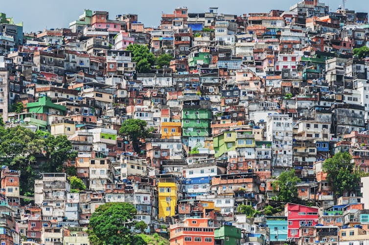 favela of colorful small buildings clustered tightly on a hillside