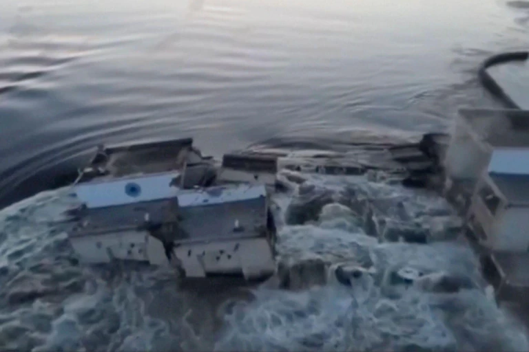 Water flows through a massive breach in the Nova Kakhovka dam near Kherson, Ukraine.