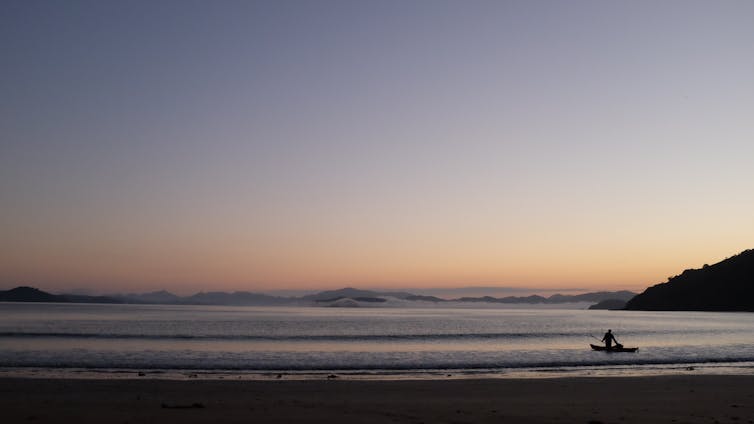 An evening view of a beach in the Bay of Islands.