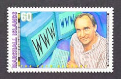 A pencil drawing on a stamp showing a smiling man next to two computer screens with www on them