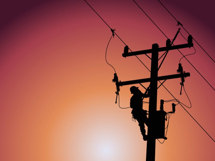 repair person climbs power pole