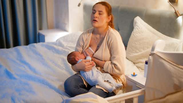 Woman tired breastfeeding