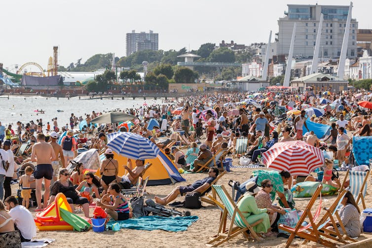 A crowded beach on a sunny day.