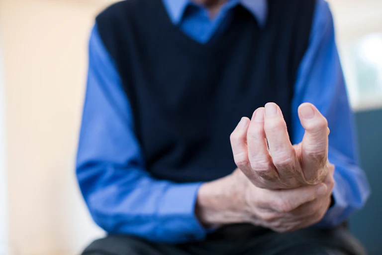 Man holding his wrist