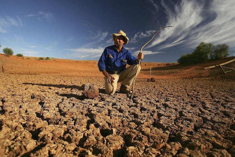 A stockman stands in the dry bed of a creek on his property in Australia in 2005 during a severe drought that coincided with El Nino.