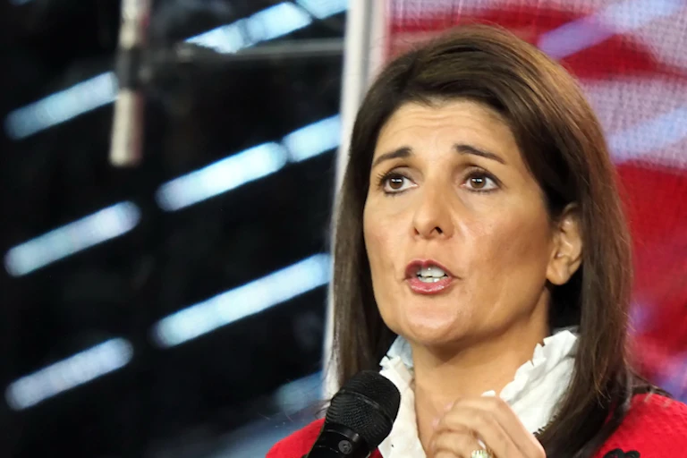 A woman in front of a microphone.