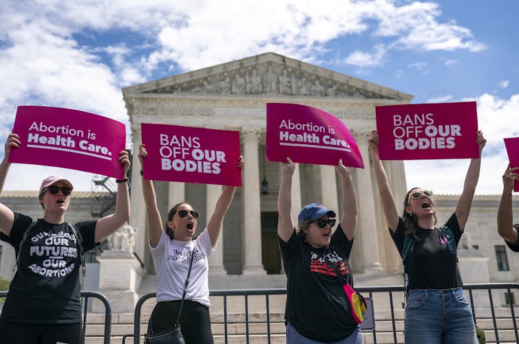 Protesters cheer during a Planned Parenthood rally in support of abortion access outside the Supreme Court on April 15, 2023, in Washington
