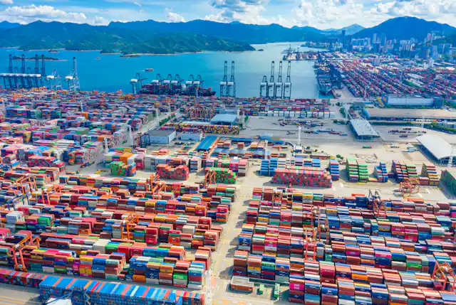 A huge shipping port in China with shipping containers as far as the eye can see.