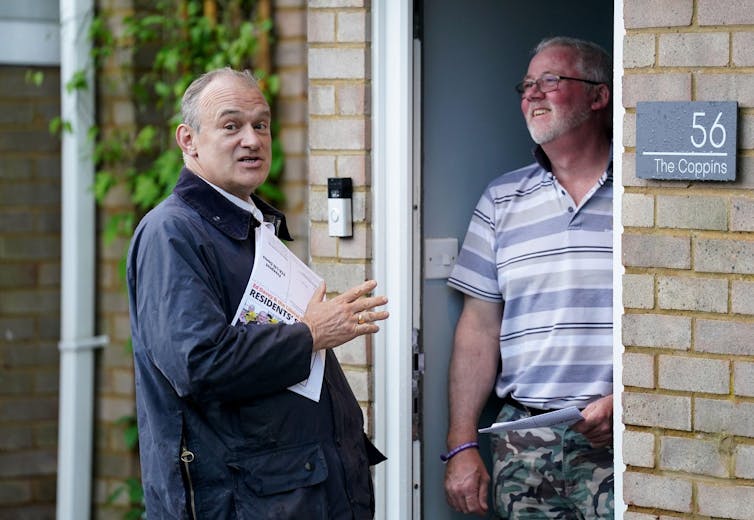 Ed Davey talking to a man on his doorstep.