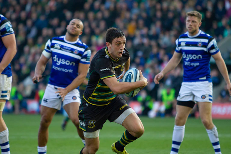 Rugby player running with the ball.