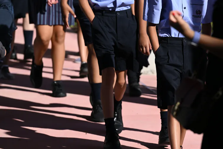 School students walking.