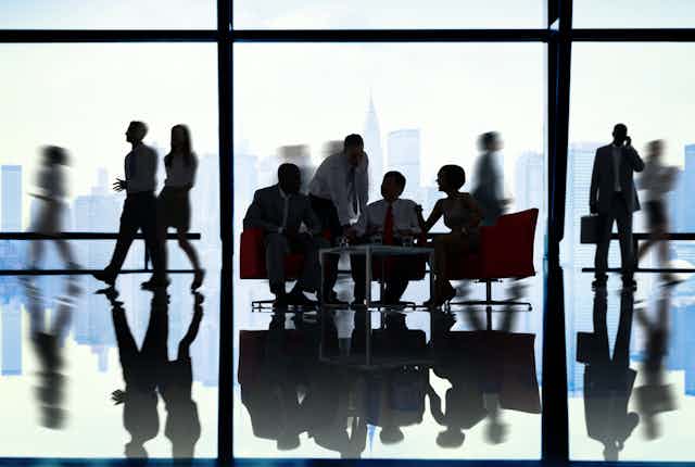 People sitting at a boardroom table