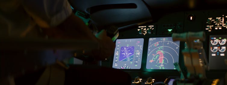 Weather radar screen inside the cockpit of an aircraft.