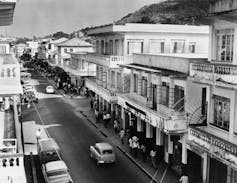 A street with buildings and cars.